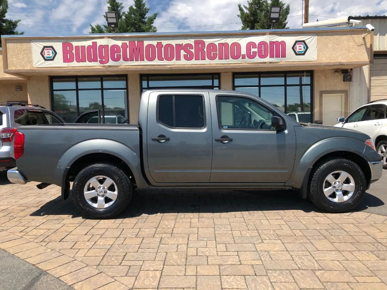 Gray 2009 Nissan Frontier Pickup Truck Four-Wheel Drive 5-Speed Automatic