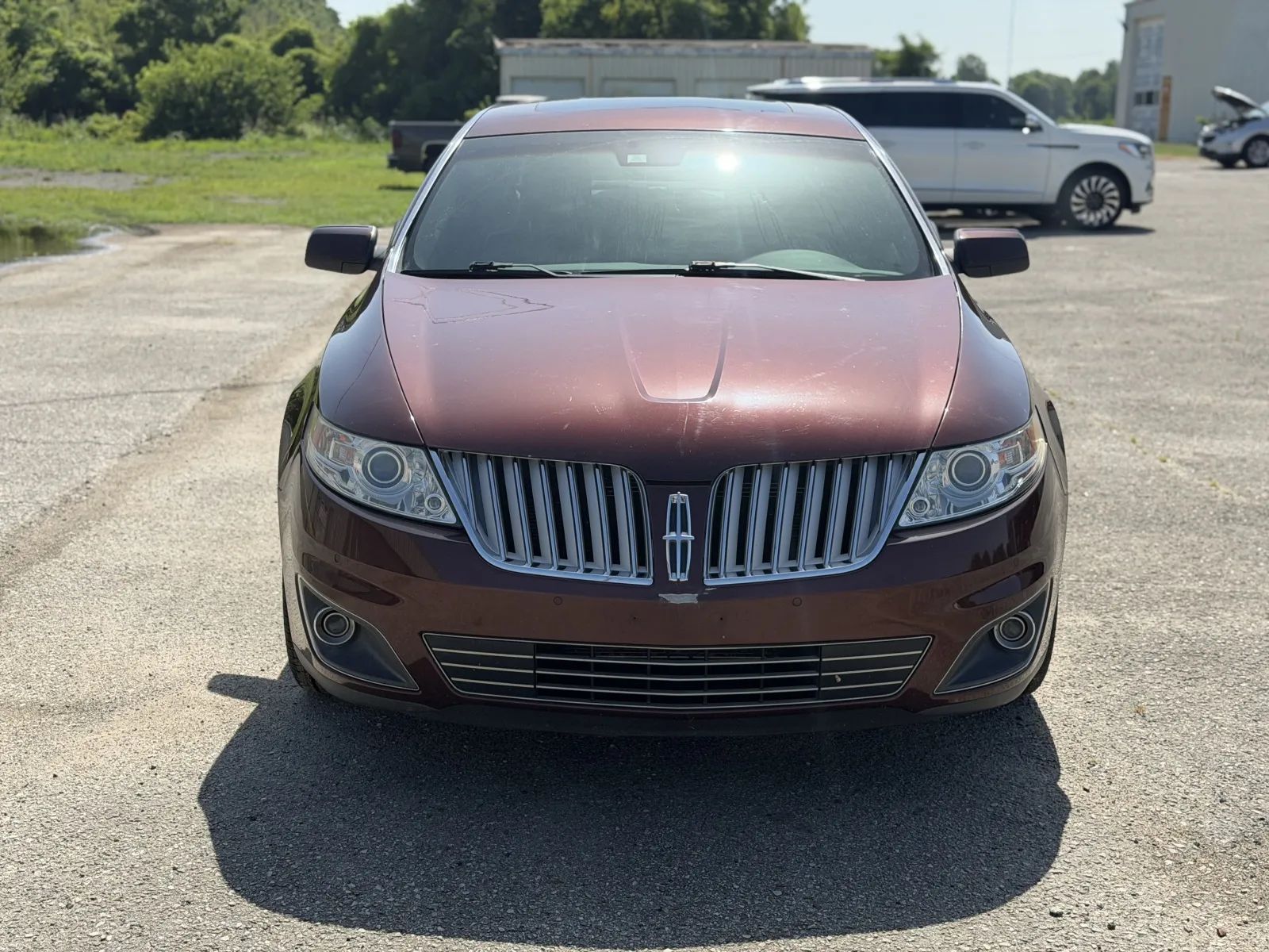 Red 2012 Lincoln MKS Sedan Front-Wheel Drive
